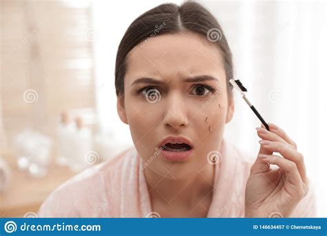 Beautiful Woman With Fallen Eyelashes And Cosmetic Brush Stock Image