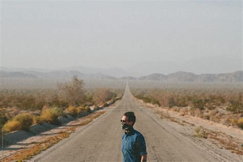 Man In Desert Road By Stocksy Contributor Jesse Morrow Stocksy