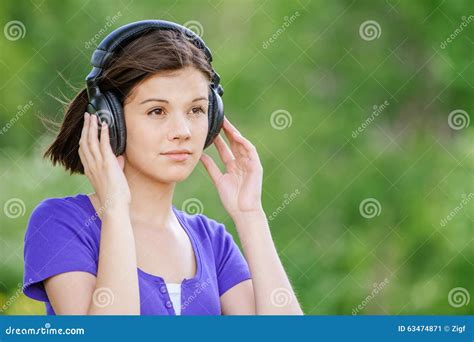 Close Up Portrait Of Young Woman Wearing Headphones Stock Image Image