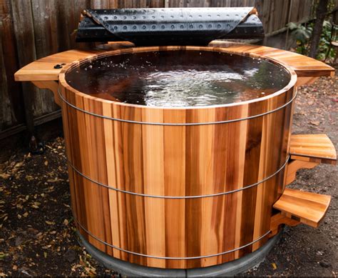 A wooden hot tub is a gorgeous addition to any backyard. Round Western Red Cedar Hot Tubs - Robert's Hot Tubs