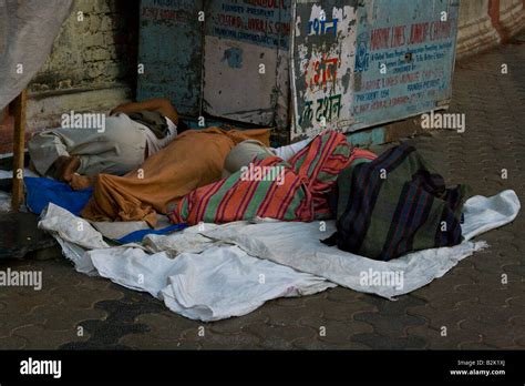 Homeless People Sleeping In The Streets Of Mumbai South India Stock