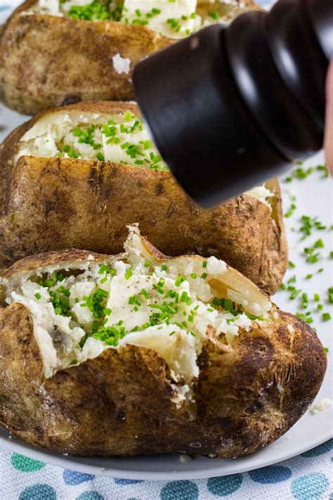 The baked potato is a staple of the barbecue steak houses, that seem to go with just about any meal! Baked Potatoes On The Grill - BBQing with the Nolands