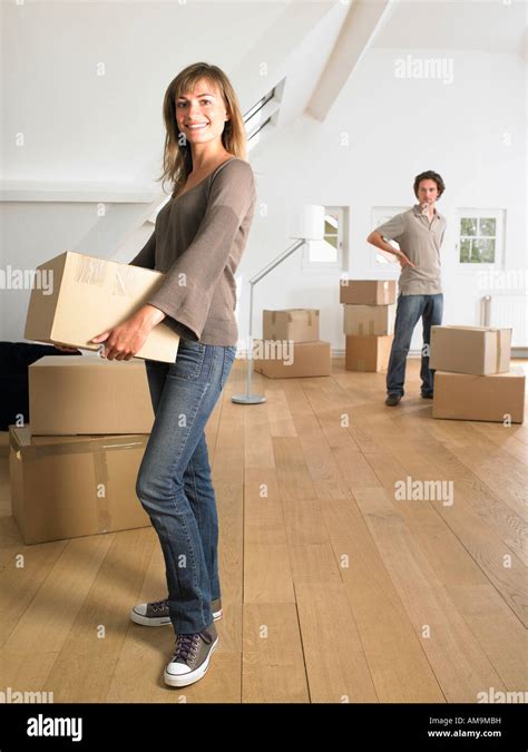 Couple Moving Into New Home Smiling Stock Photo Alamy
