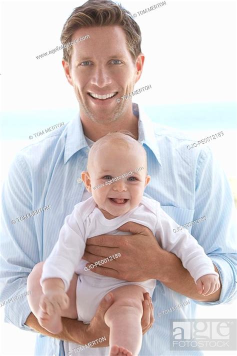 Man Holding Baby Stock Photo Picture And Royalty Free Image Pic Ojo