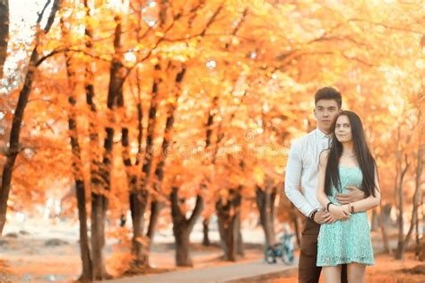 Young Couple On A Walk In Autumn Park Stock Image Image Of Outdoor