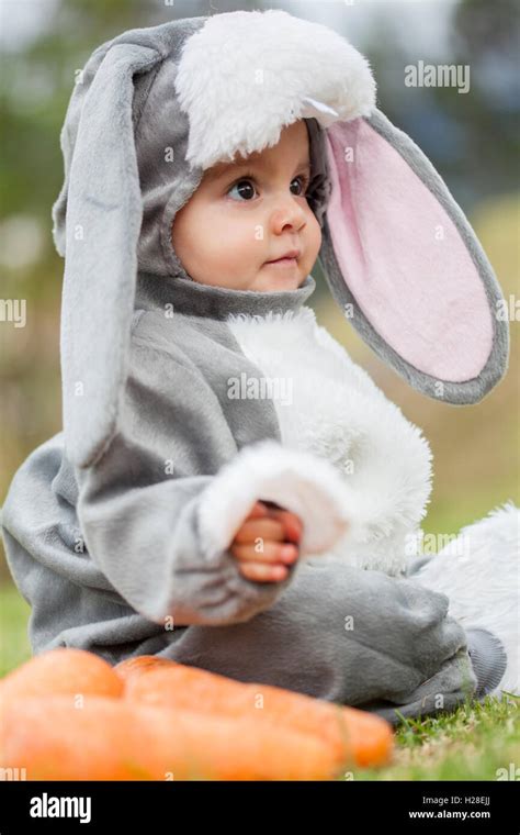 Little Baby Girl Wearing A Rabbit Costume Stock Photo Alamy