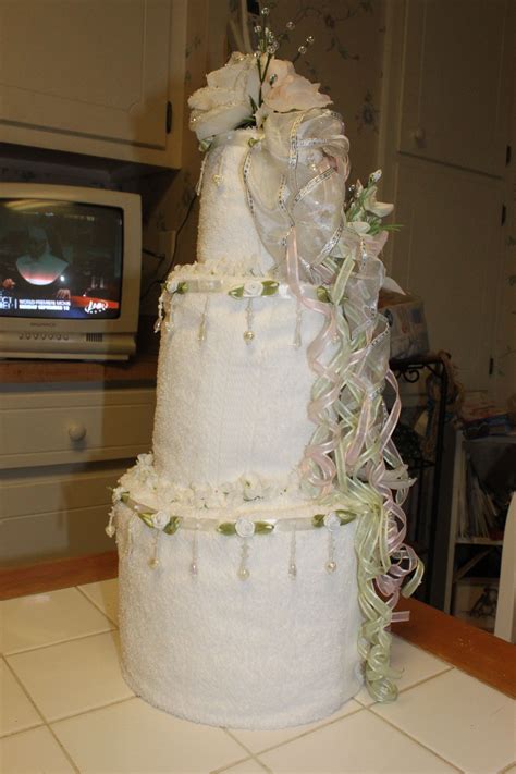 We have lots of bridal shower towel cake ideas for people to select. "Wedding Cake" made of towels & accented with ribbons ...