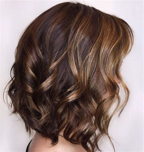 The difference between balayage and highlighting is that in balayage, the process starts from the middle of the hair, while in highlighting, it starts from the bottom of the hair. Curly Brown Bob With Caramel Highlights | Brown hair with ...
