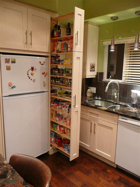 Kitchen pantry is one of those things that can help you maintain cleanness and organization of your house. The narrow cabinet beside the fridge pulls out to reveal a ...