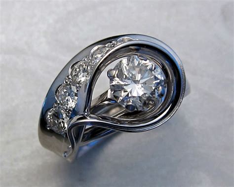 What are the differences between engagement rings, wedding rings and bands and what is the meaning behind them. Solitaire Enhancer — Metamorphosis Jewelry