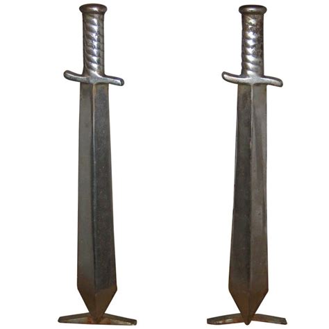 Pair Of Cast Iron Sword Andirons C 1910 At 1stdibs
