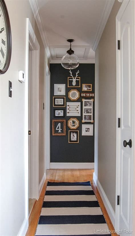 Consider decorating open floor plan rooms with furniture adjacent to the hallway. Updated Hall Gallery Wall | Small hallway decorating ...