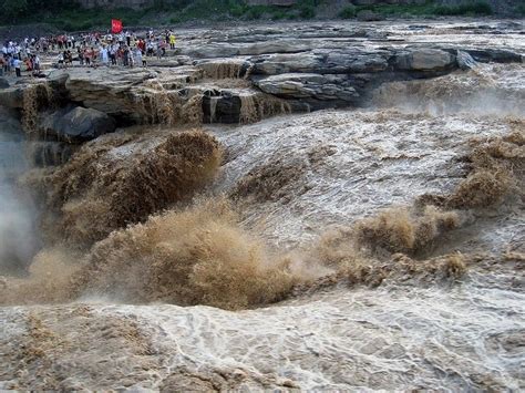 Hukou Waterfall The Yellow Waterfall In China Lazy Penguins
