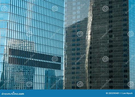 Reflection Of Other Buildings And The Sky On The Glass Walls Of Modern