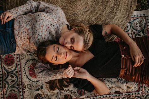 Houston Engagement Session Lesbian Couple Laying Down Pose Holding Hands Eyes Closed Boho