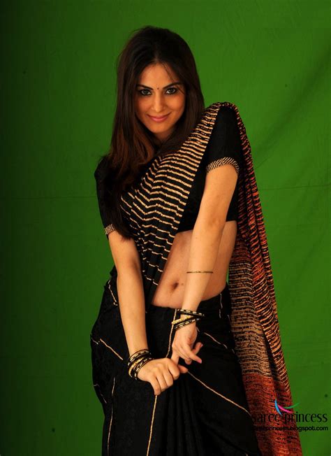 Shraddha Arya Showing Delecious Curves In A Black Saree Photoshoot