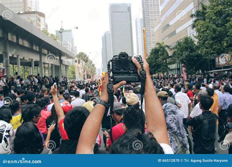 Taking Pictures In The Crowd With A Camera Editorial Image Image Of