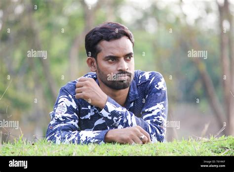 Portrait Of A Young Man Sleeping On A Grass Field Stock Photo Alamy