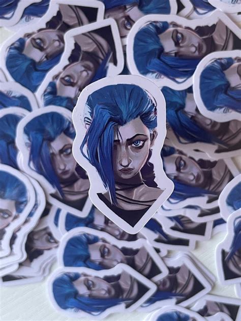 Some Stickers With Blue Hair On Them