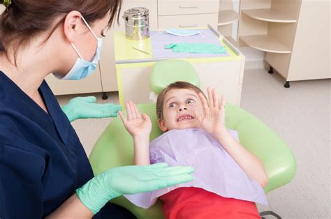 If that's important to you or your child. Dentist Doctor Calming Scared Kid Patient Stock Photo ...