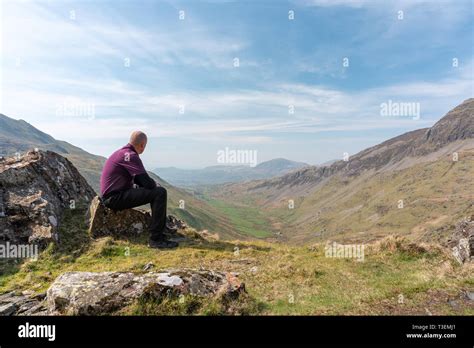 A Walker Admiring The View Of Cwm Croesor From Cnicht Gwynedd Wales