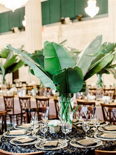 Escaping to a tropical island always sounds like a good idea, and the thought is particularly appealing after time spent at home without travel this past year! 50 Green Tropical Leaves Wedding Ideas - Hi Miss Puff