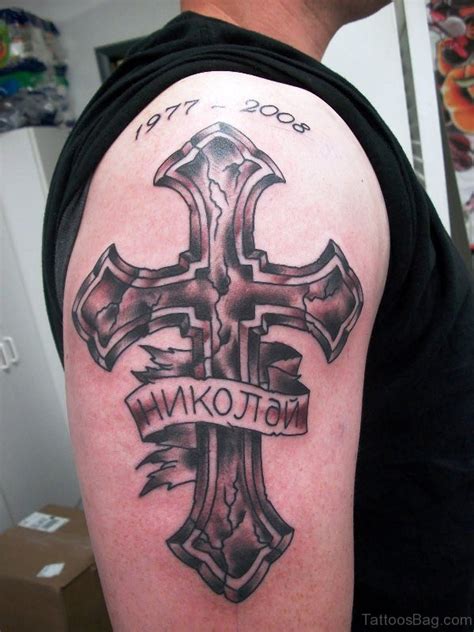Both men and women can get shoulder tattoos; 70 Adorable Cross Tattoos On Shoulder