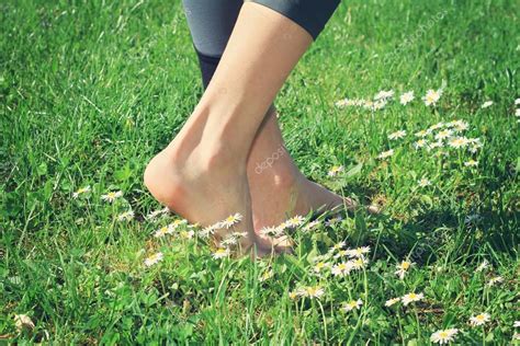 Woman Bare Feet Walking On Green Grass Stock Photo By ©glisicalbina