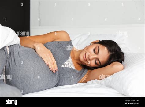 Image Of An Amazing Healthy Pregnant Woman Indoors At Home Lies In Bed