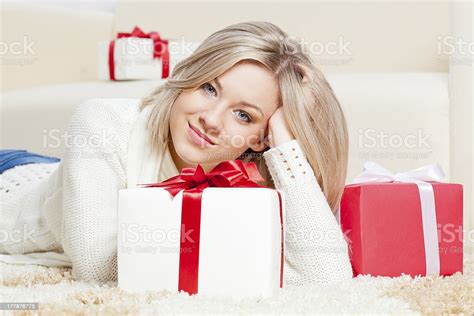 Blonde Woman Laying On The Floor With Ts Stock Photo Download