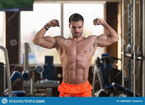 Handsome Muscular Man Flexing Muscles In Gym Stock Image Image Of