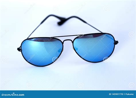 Blue Mirrored Sunglasses With Anti Reflective Coating And Uv Protection On A White Background