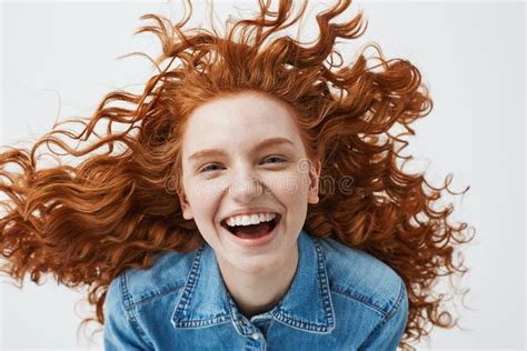 Pretty Cheerful Redhead Girl With Flying Curly Hair Smiling Laughing