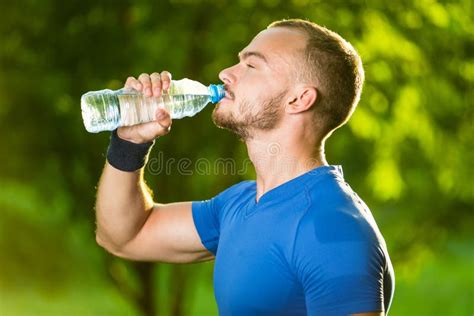 Athletic Mature Man Drinking Water From A Bottle Stock Image Image Of
