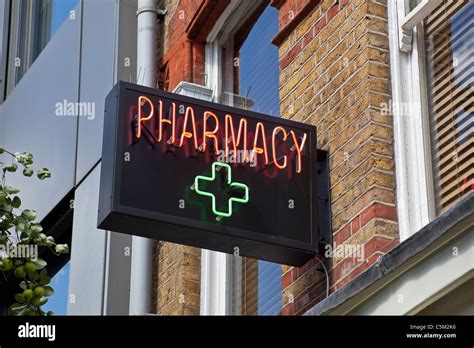 Pharmacy Neon Green Cross Sign Hi Res Stock Photography And Images Alamy