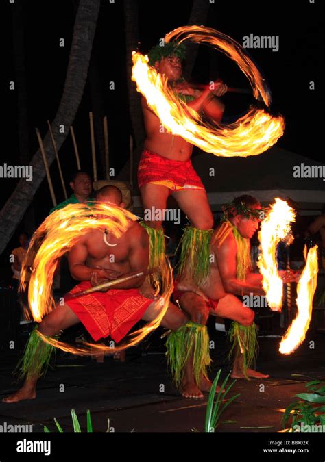 Traditional Hawaiian Fire Dance Performed By Three Mail Dancers Stock