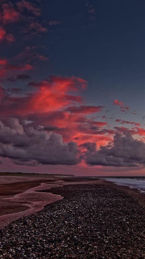 Download Wallpaper 720x1280 Sunset Beach Sea Waves Clouds Sky Sea