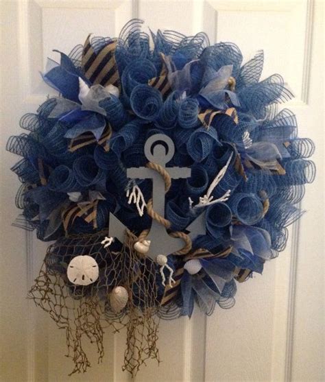 A Blue Wreath With An Anchor Starfish And Other Items Hanging On The