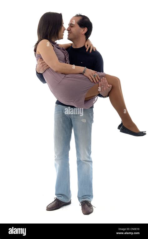 Full Length Couple With Man Holding Woman In Arms Isolated On White