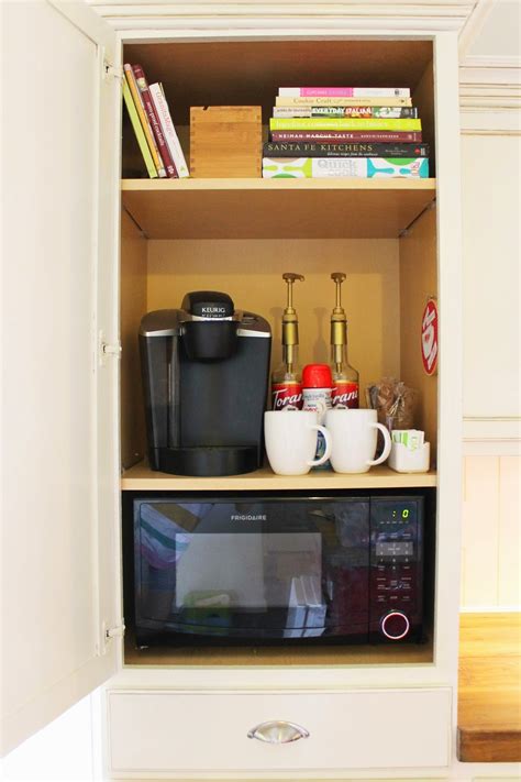 Elevate your space with practical storage solutions, ﻿perfect for a busy kitchen. The ragged wren : Hidden Coffee Storage &Trashcan Cabinet