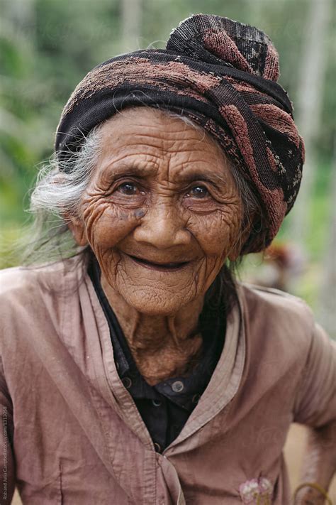 Portrait Of Old Wrinkled Balinese Woman In Nature By Stocksy