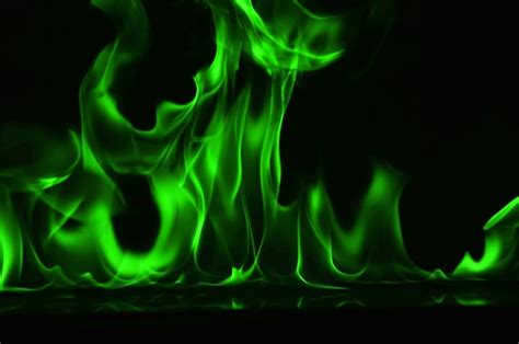 Premium Photo Abstract Green Fire Flames On Black Background