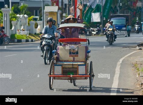 Riding In A Becak Or Bicycle Rickshaw In Makassar On Sulawesi In
