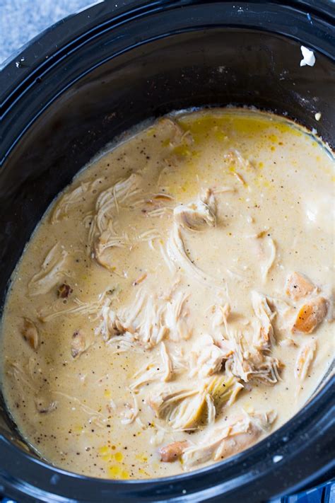 In your slow cooker, whisk together the gravy packets, cream of chicken soup, and water until smooth. Crock Pot Chicken and Gravy - Spicy Southern Kitchen