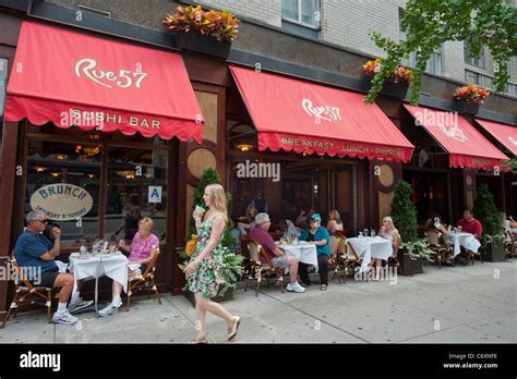 Diners Eat Outside At A Sidewalk Cafe Of The Rue 57 Restaurant In Stock