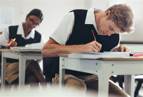 Students Concentrating While Writing During Exam Stock Image Image Of