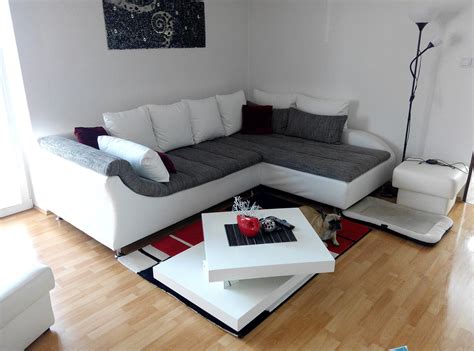 Modern sectional sofa with sleek track arm design and a customizable floating ottoman. Sofa 14 - Craft Welt