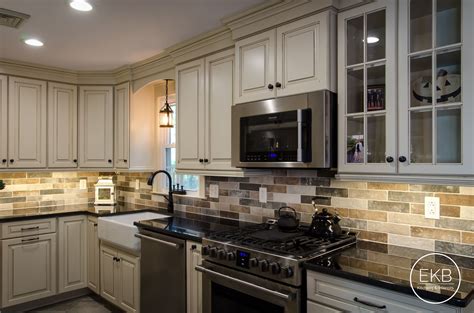 Painted cabinets with a dark glazed finish completed this kitchen remodel. Waypoint 660R cabinets in Painted Hazelnut Glaze and Granite Absolute Black countertops ...