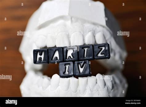 Teeth With Hartz Iv Logo Clenched Teeth Stock Photo Alamy