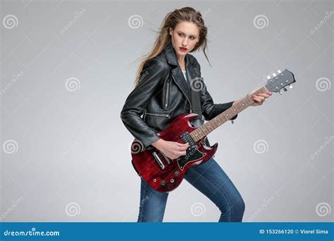 Thoughtful Young Women Playing Electric Guitar Stock Photo Image Of